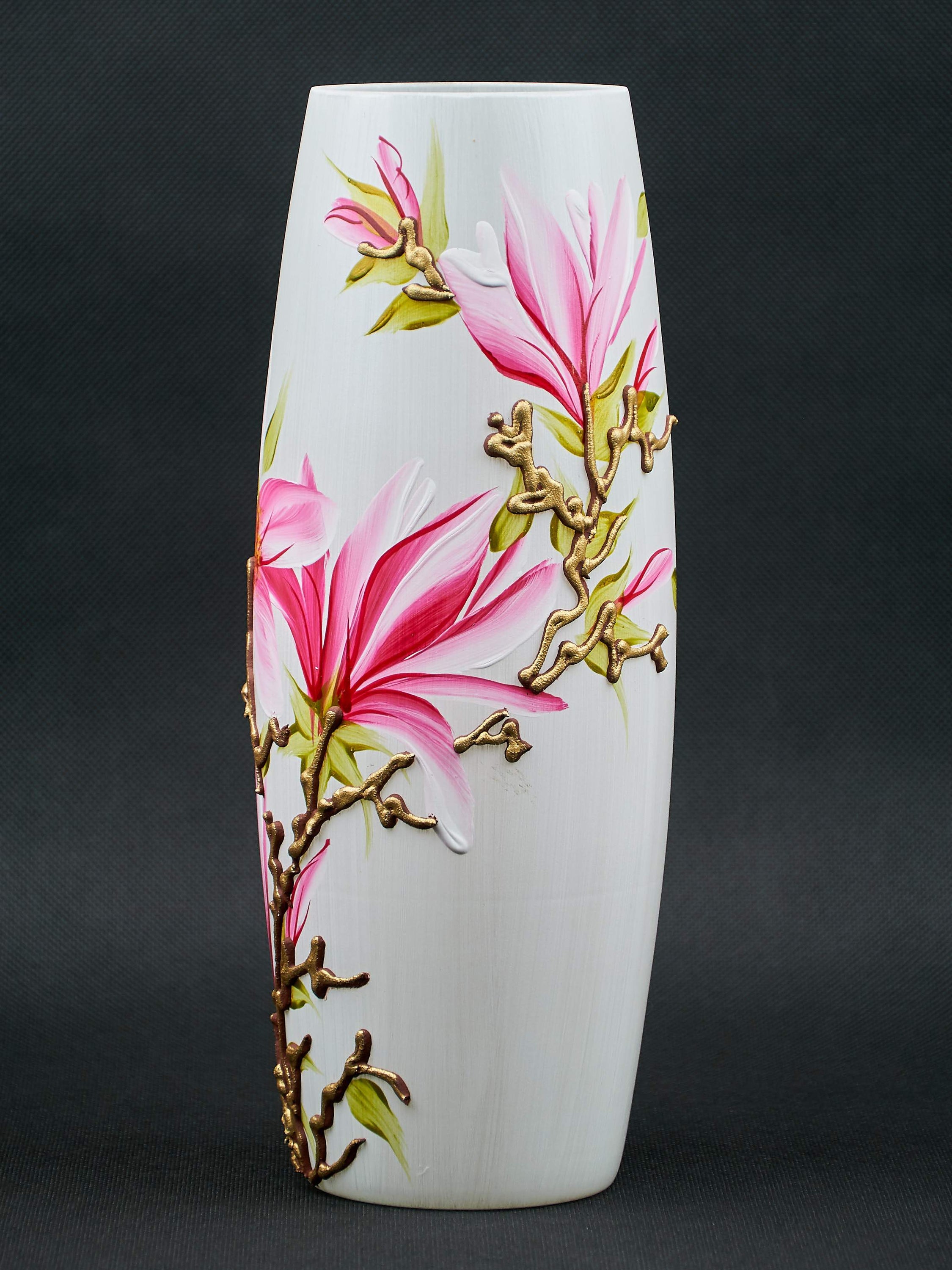 A beautifully hand-painted glass vase featuring unique floral and geometric designs, perfect for displaying flowers in any interior setting.