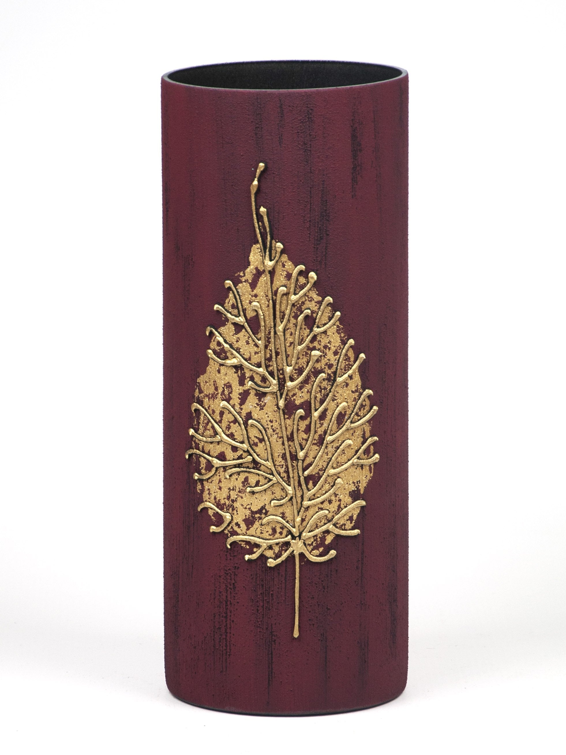 A beautifully hand-painted glass vase in burgundy, showcasing intricate floral designs, perfect for displaying flowers.