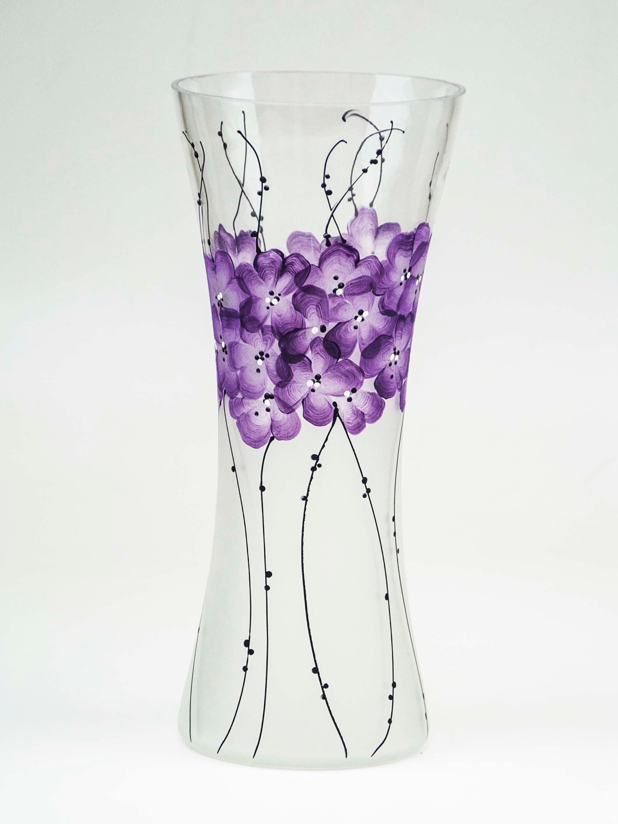A beautifully hand-painted glass vase featuring intricate floral and geometric designs, showcasing vibrant colors and unique artistry.