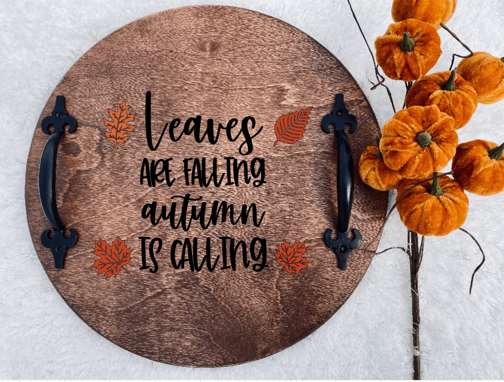 Hand-painted wooden serving tray with black and orange design, featuring black metal handles, perfect for fall decor.