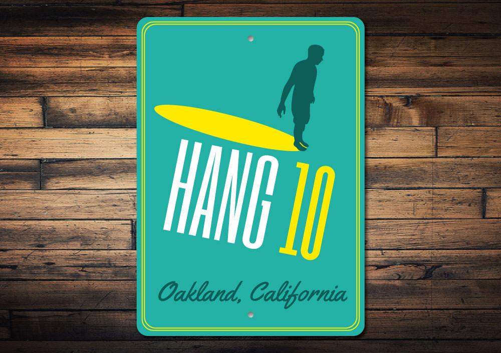 A vibrant Hang 10 sign made of high-quality aluminum, featuring beach-themed design elements, perfect for coastal decor.