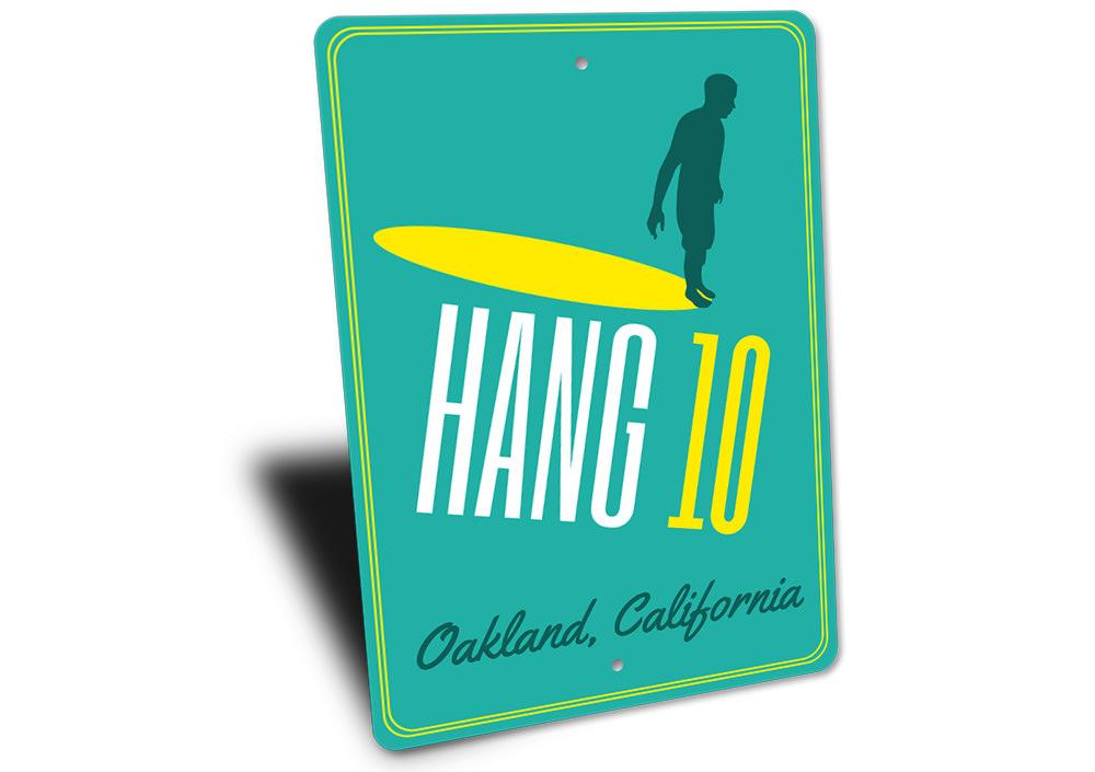 A vibrant Hang 10 sign made of high-quality aluminum, featuring beach-themed design elements, perfect for coastal decor.