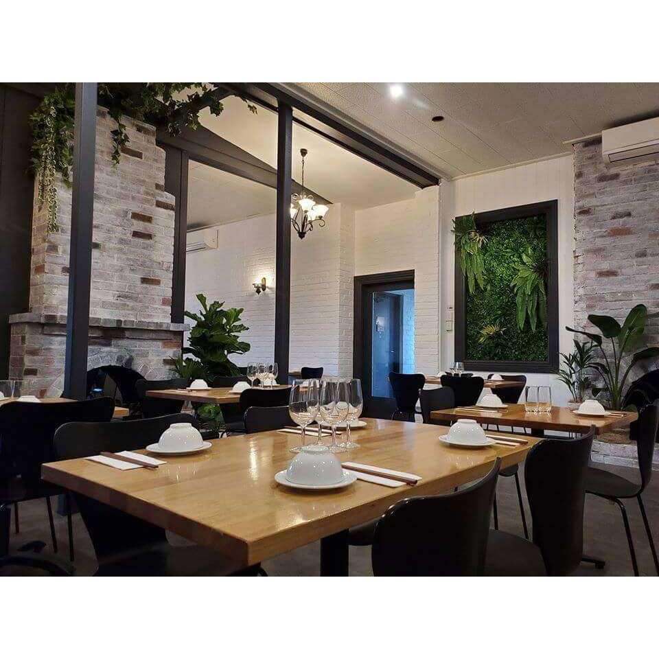 A lush 100cm Hanging Artificial Boston Fern with vibrant green leaves, perfect for indoor and outdoor decor.