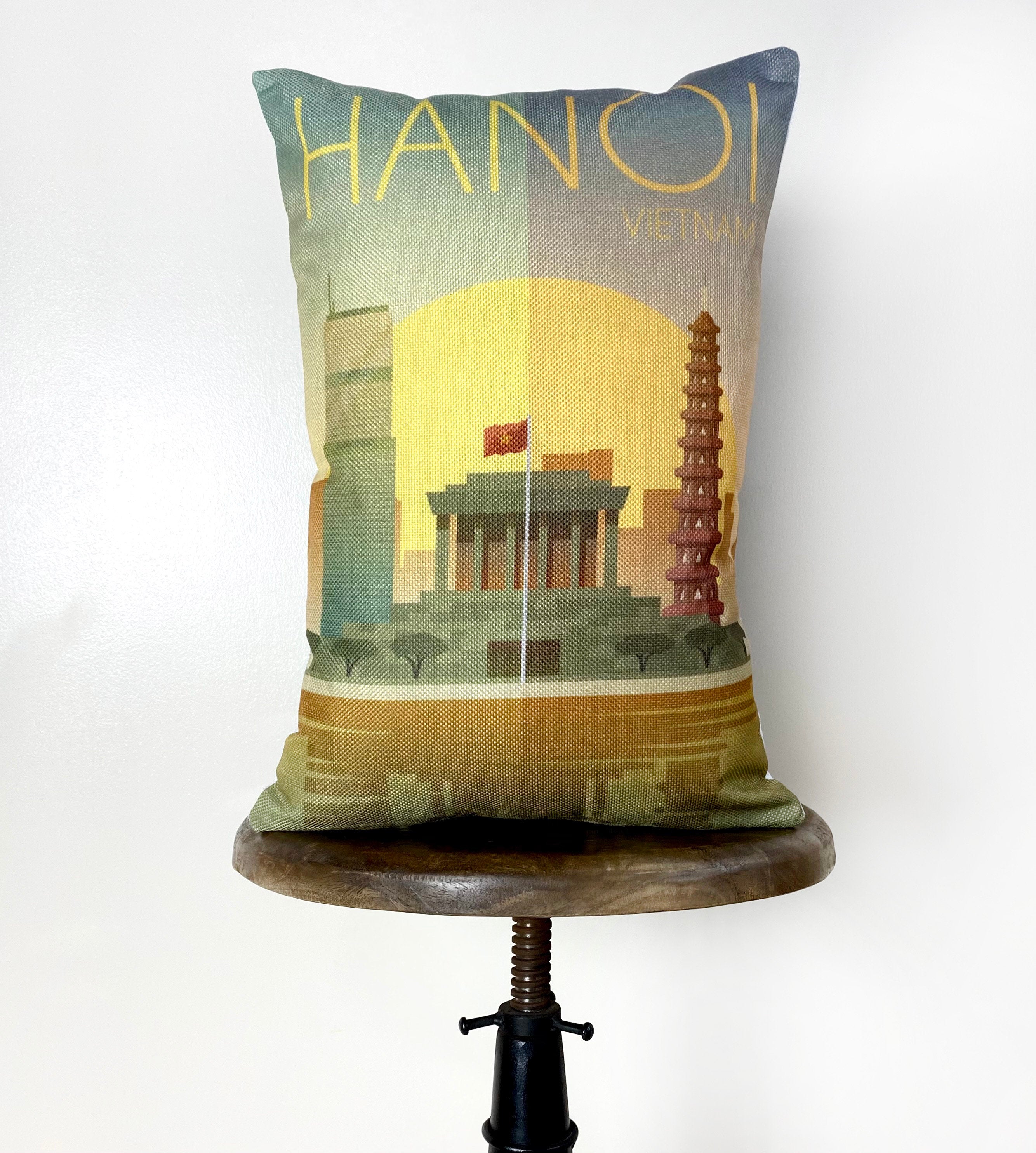 Colorful 12x18 pillow cover featuring a sunset and city reflection of Hanoi, Vietnam, with a concealed zipper.