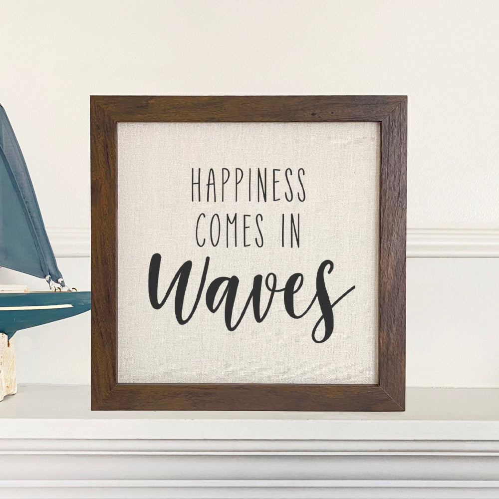 Happiness Comes in Waves framed sign with a stylized wood frame, featuring a linen-look background and eco-friendly printing.