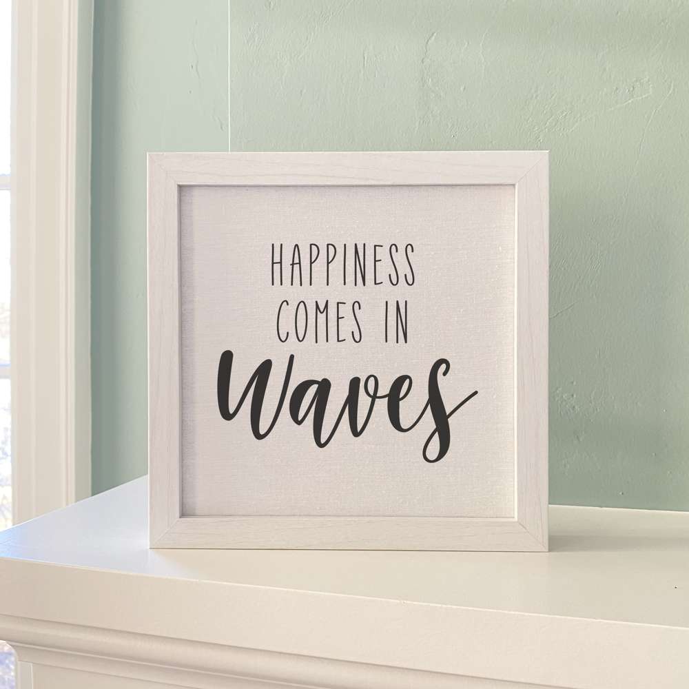 Happiness Comes in Waves framed sign with a stylized wood frame, featuring a linen-look background and eco-friendly printing.