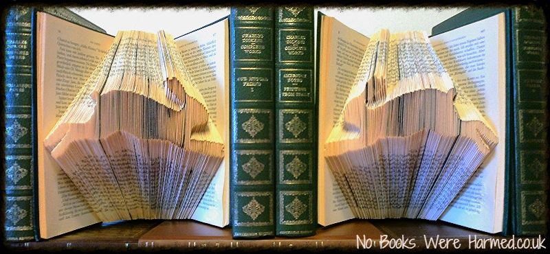 A beautifully crafted Hare Pair art piece made from hand-folded pages of vintage books, showcasing two opposing hares in intricate detail.