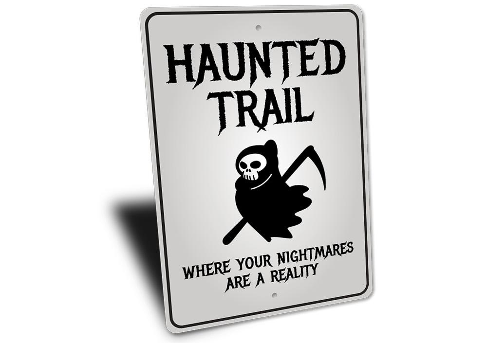 A spooky Haunted Trail Sign made of high-quality aluminum, featuring eerie graphics perfect for Halloween decorations.