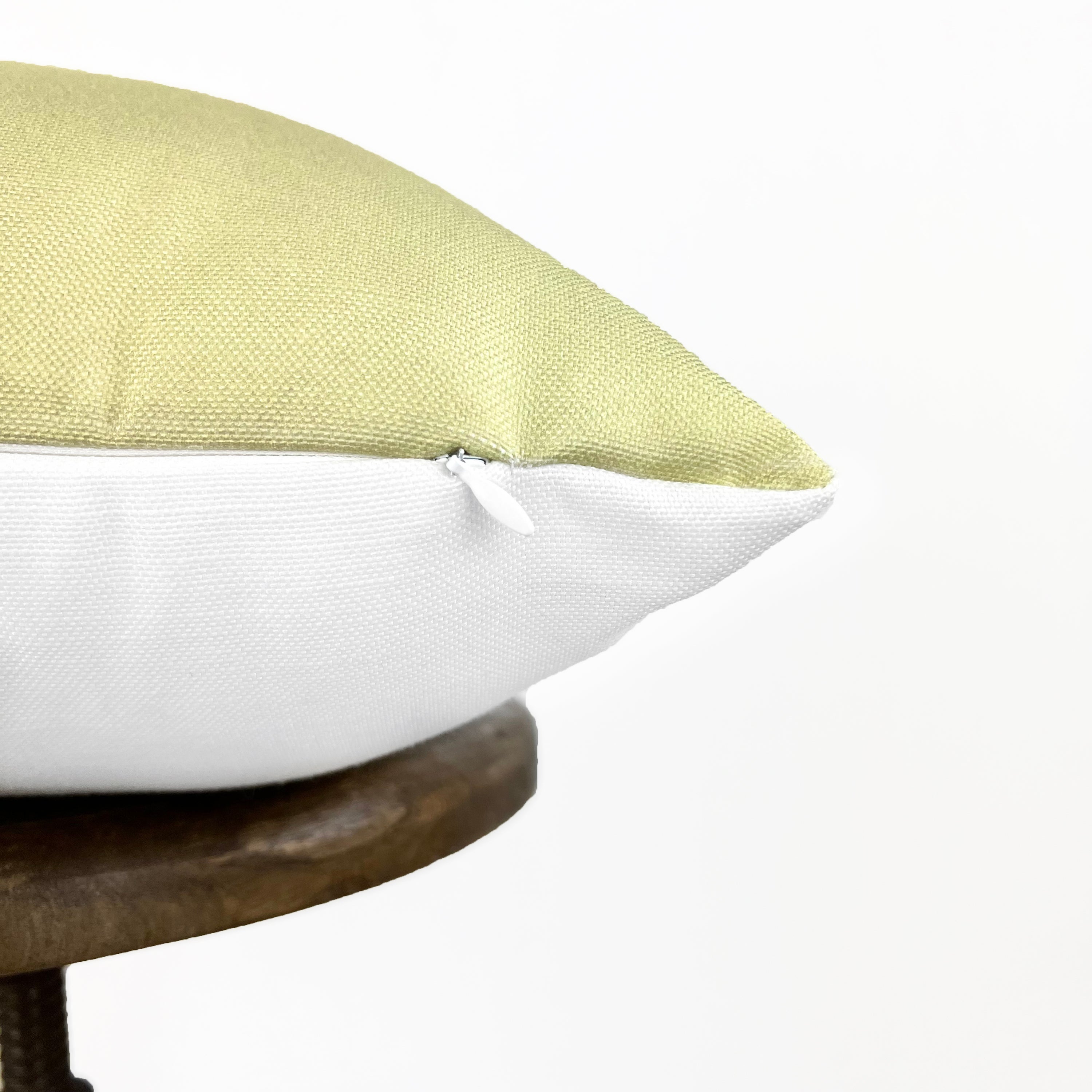 He Is Risen accent pillow with white background and colorful Spring design, perfect for Easter decor.