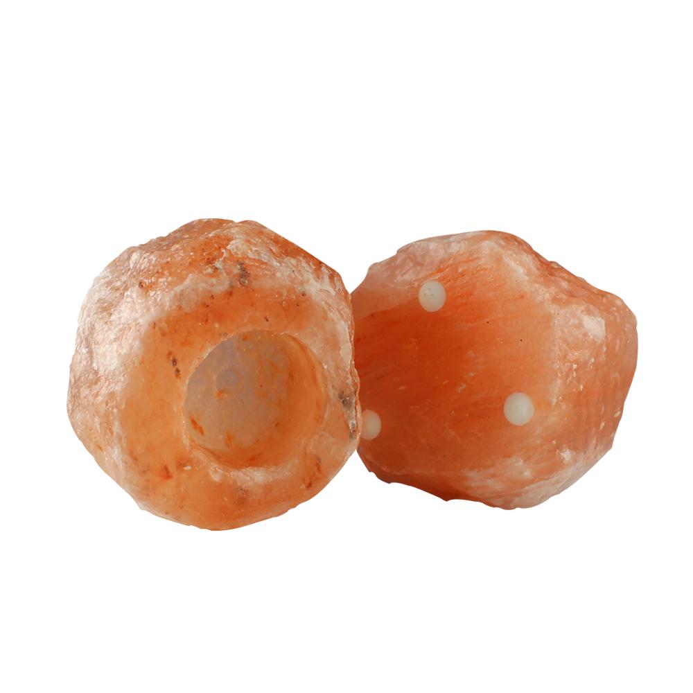 Himalayan Rock Salt Candle Holder in pink, showcasing its unique shape and natural texture, perfect for home decor and air purification.
