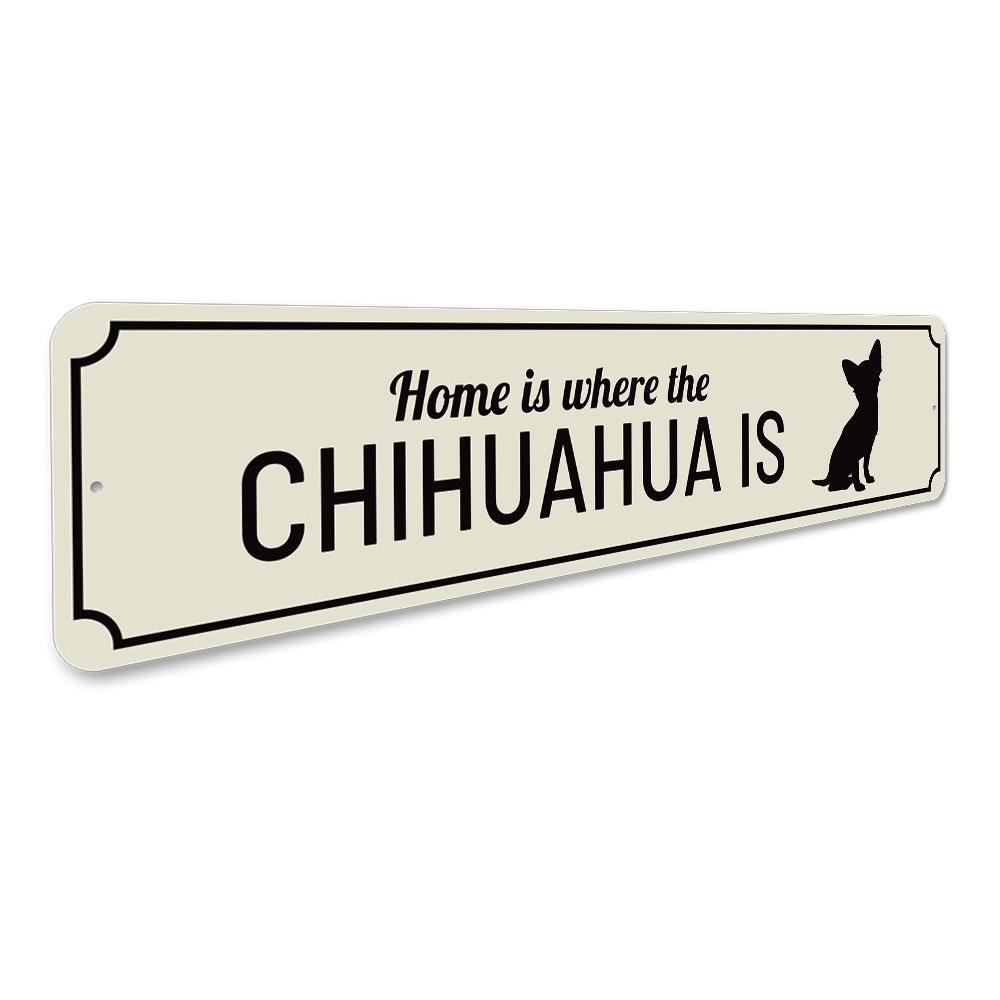 A decorative aluminum sign that reads 'Home is Where the Dog is', featuring a charming design perfect for dog lovers.