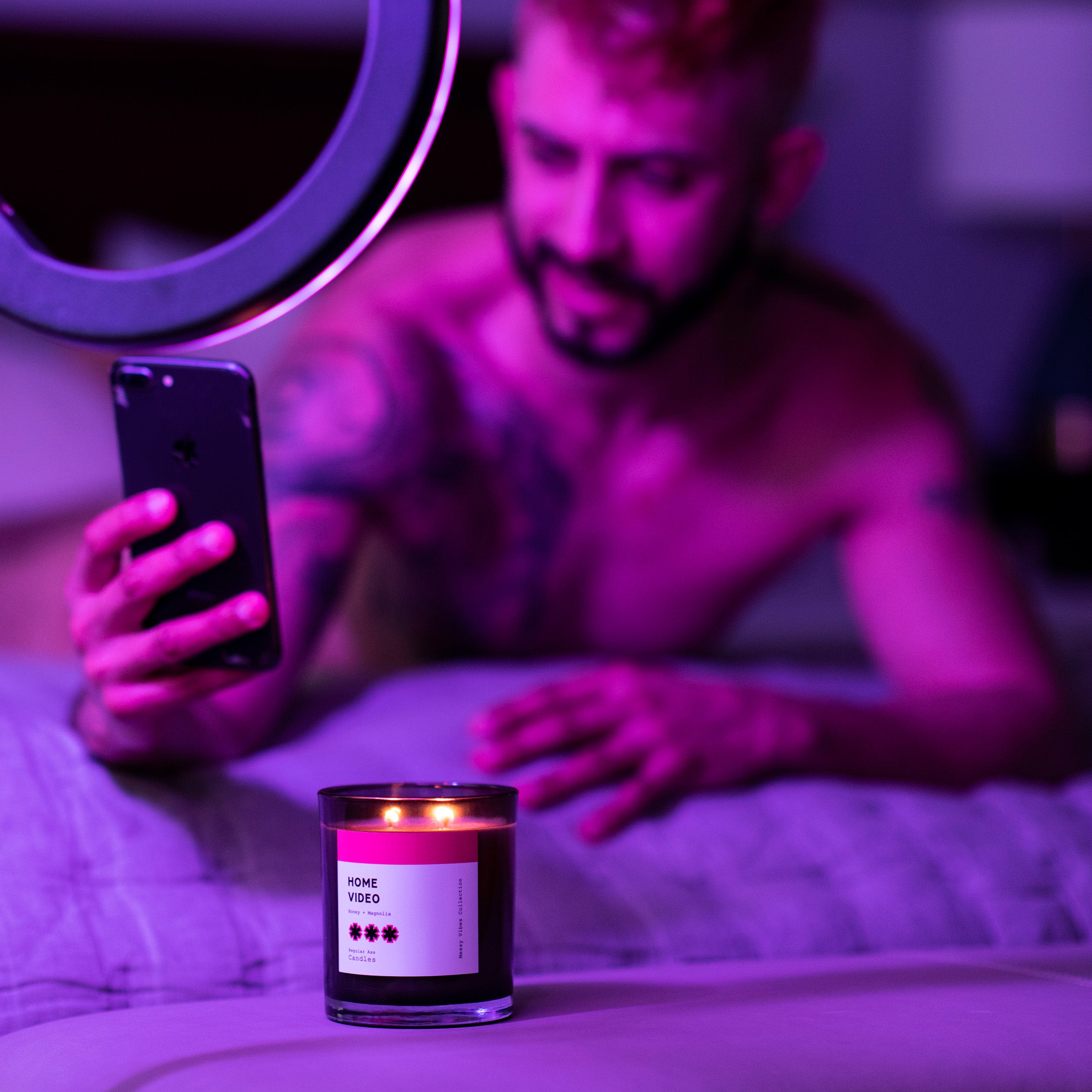 Home Video Honey + Toffee 11oz Candle in a stylish jar with a warm glow, showcasing its floral and sweet fragrance.