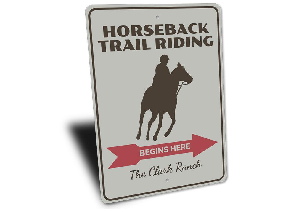 A decorative Horseback Trail Rider Sign made of high-quality aluminum, featuring a rustic design perfect for home decor.