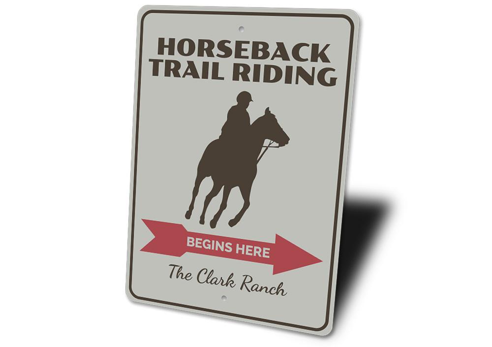 A decorative Horseback Trail Rider Sign made of high-quality aluminum, featuring a rustic design perfect for home decor.