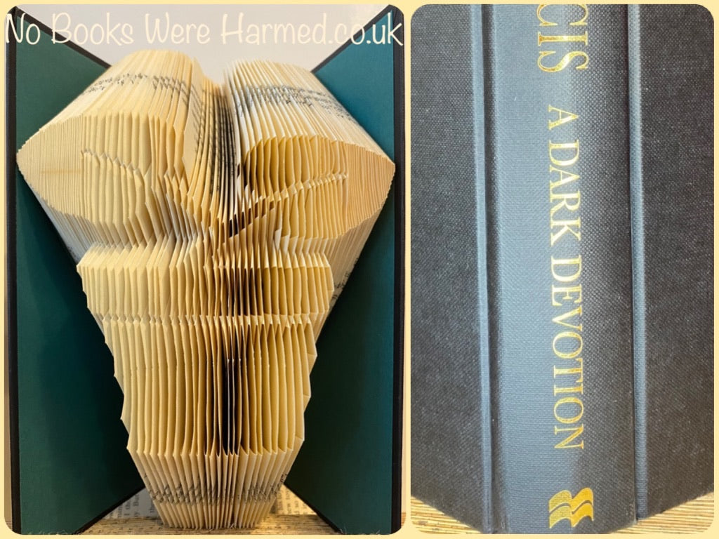 A unique hand-folded book art plant pot made from vintage books, showcasing intricate folds and a creative design perfect for home decor.