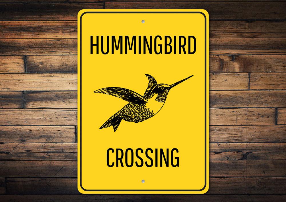 Hummingbird Crossing Sign made of aluminum, featuring vibrant colors and a decorative design, perfect for home decor.