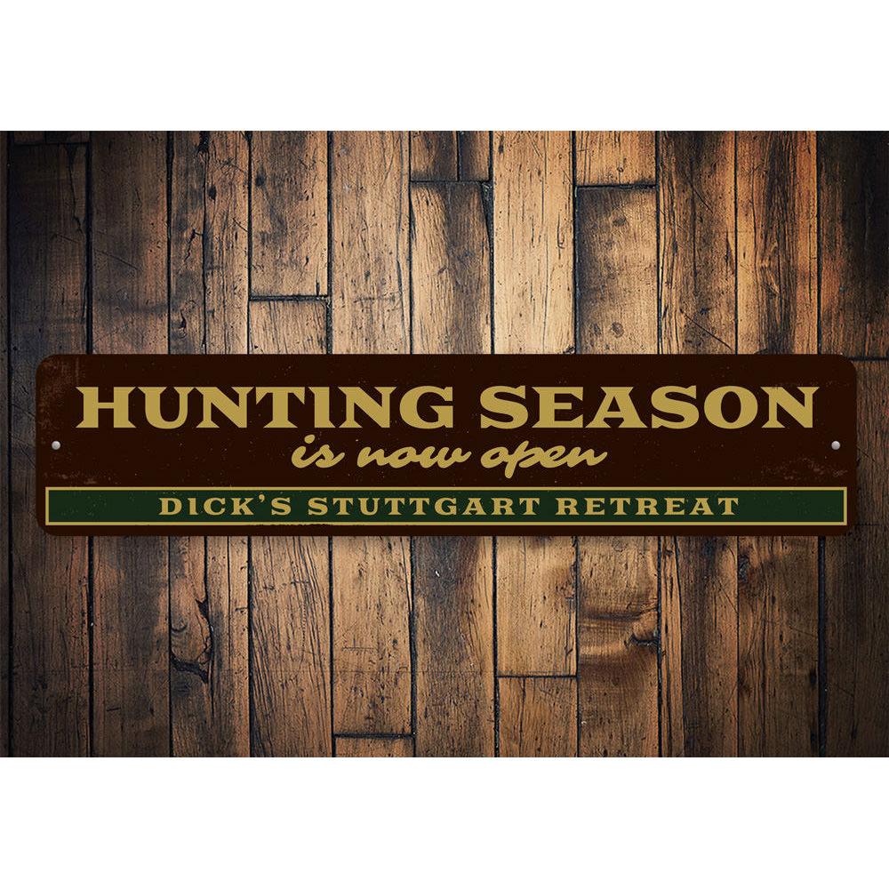 A decorative Hunting Season Open Sign made of high-quality aluminum, featuring customizable text and pre-drilled holes for easy mounting.