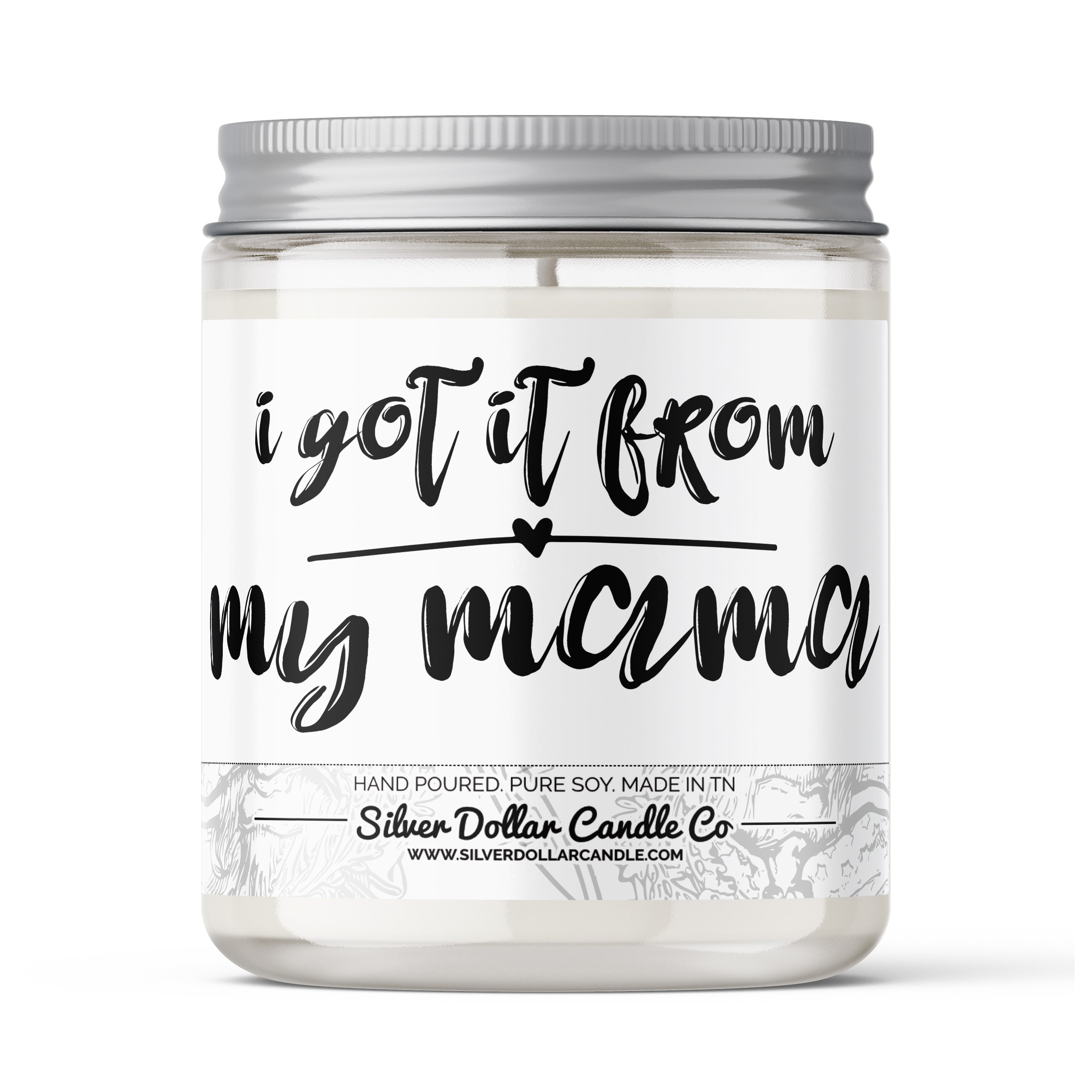 A beautifully designed candle labeled 'I Got It From My Mama' with a Sweet Honey & Ginger scent, elegantly packaged in a decorative box.