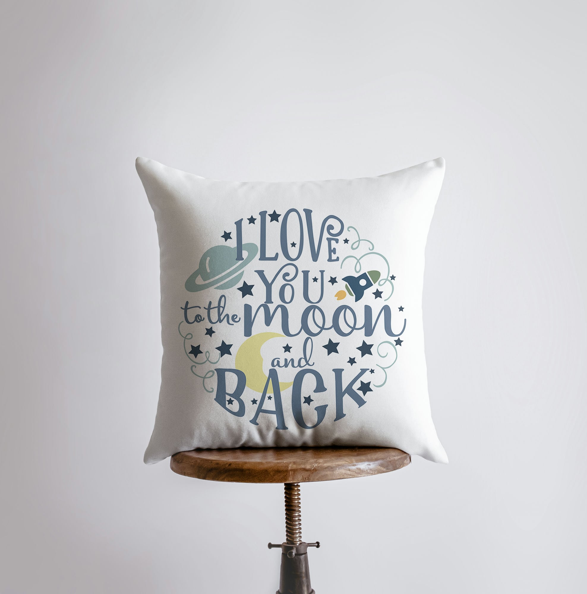 A decorative pillow cover featuring the phrase 'I Love You to the Moon and Back', designed for children's space-themed bedrooms, showcasing a concealed zipper and soft fabric.