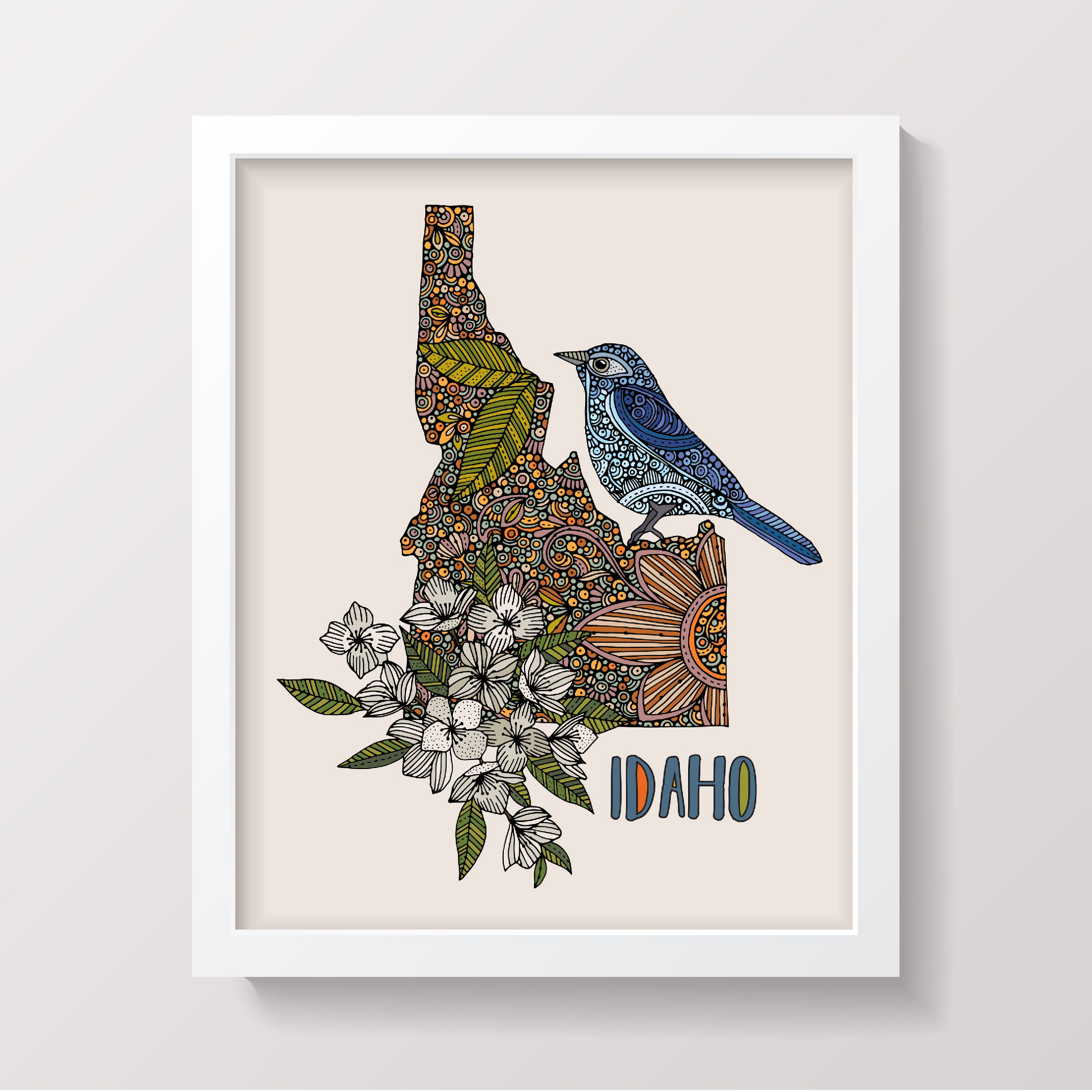 Idaho State Map featuring the Mountain Bluebird and Syringa flower, beautifully illustrated in pen and ink with digital coloring.