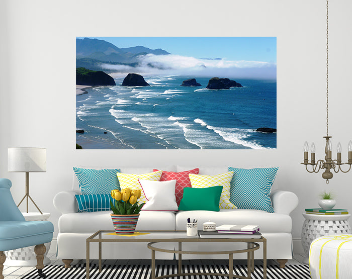 A collection of colorful removable wall decals displayed on a smooth surface, showcasing various designs and patterns.