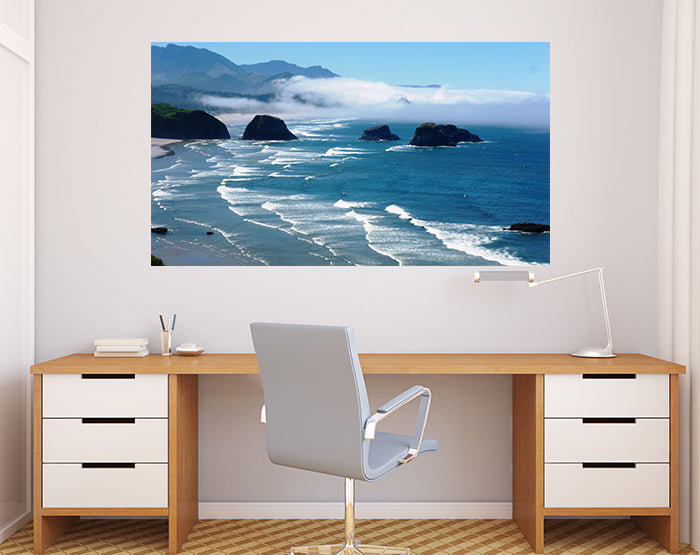 A collection of colorful removable wall decals displayed on a smooth surface, showcasing various designs and patterns.