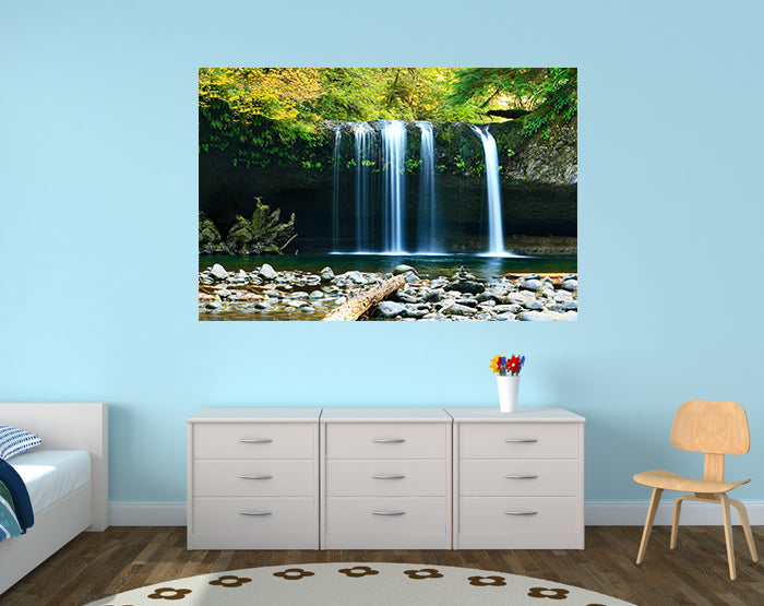 A collection of colorful removable wall decals displayed on a smooth surface, showcasing various designs and patterns.