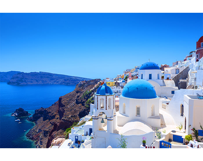 A collection of colorful removable wall decals displayed on a smooth surface, showcasing various designs and patterns.