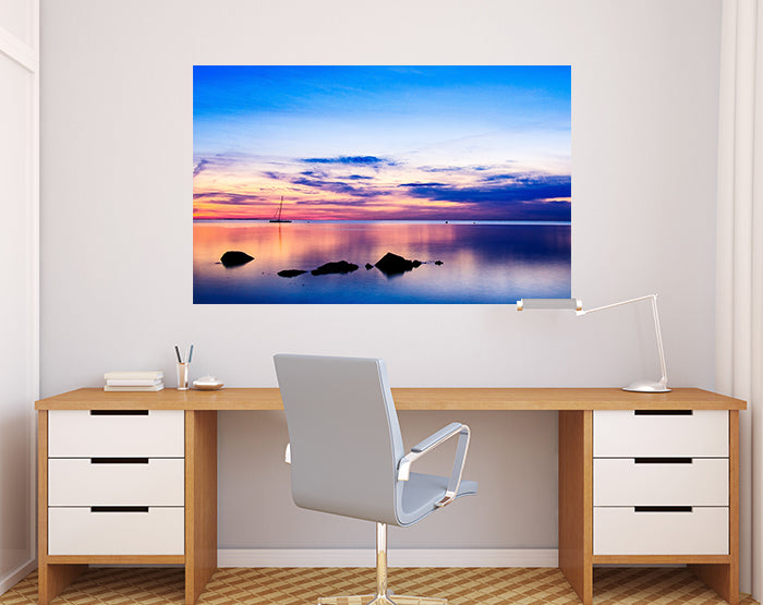 A collection of colorful and stylish removable wall decals displayed on a smooth surface, showcasing various designs suitable for home decor.