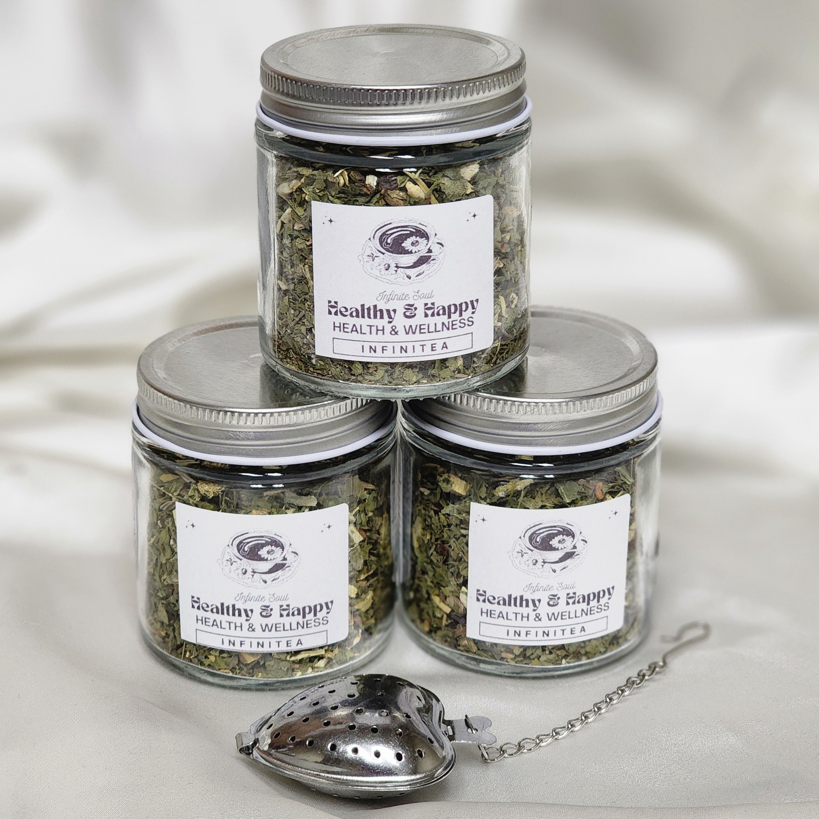 A vibrant package of Infinitea Healthy & Happy organic herbal tea blend featuring natural herbs for health and wellness.