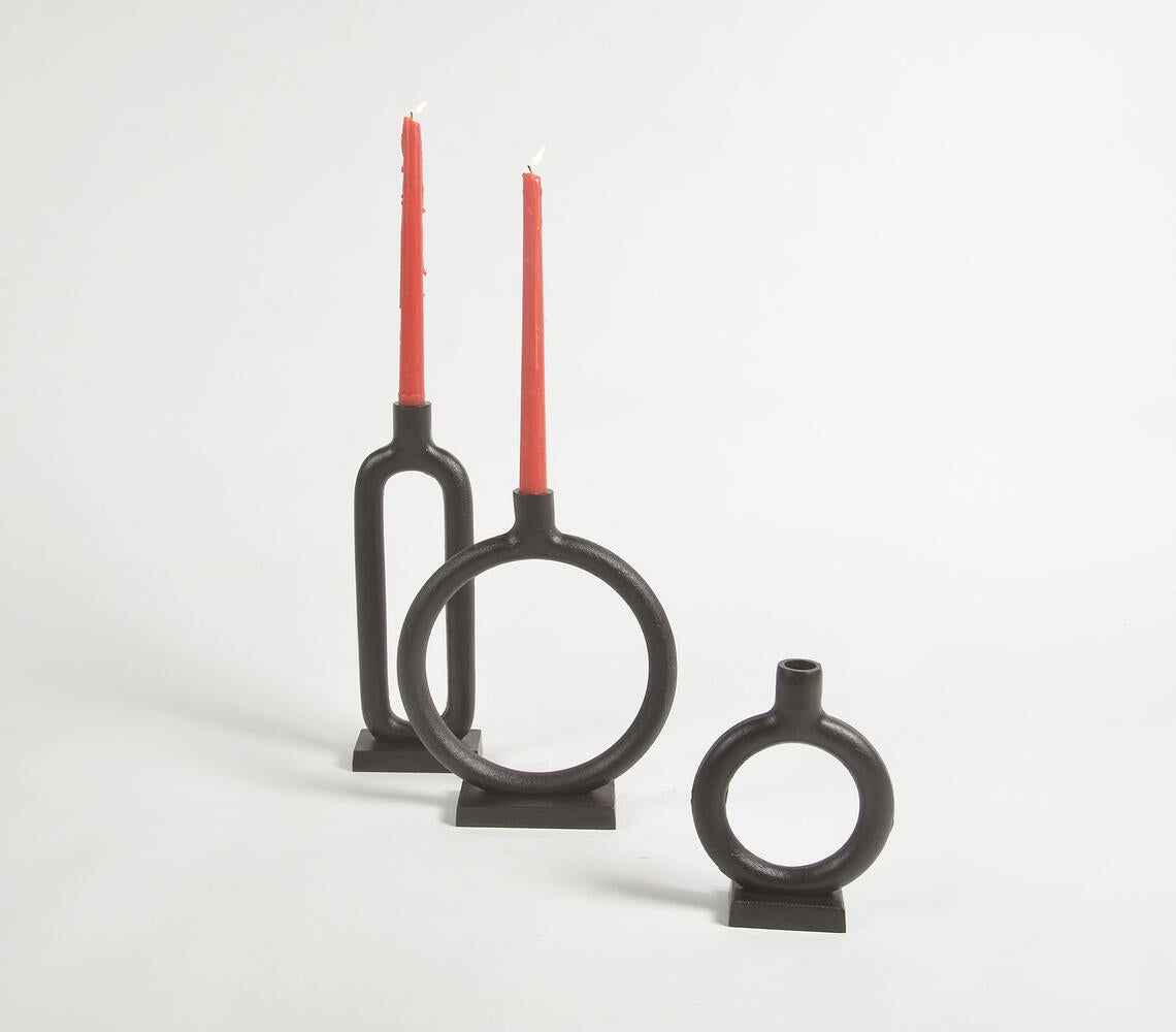 Set of 3 elegant iron black candle holders showcasing rustic charm and unique handmade design.