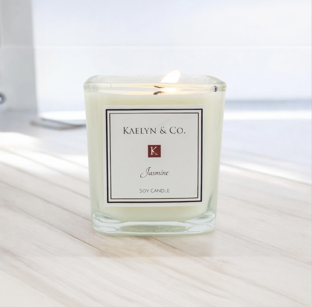 Jasmine Small Cube Candle in decorative box, featuring floral scent of jasmine and honeysuckle.