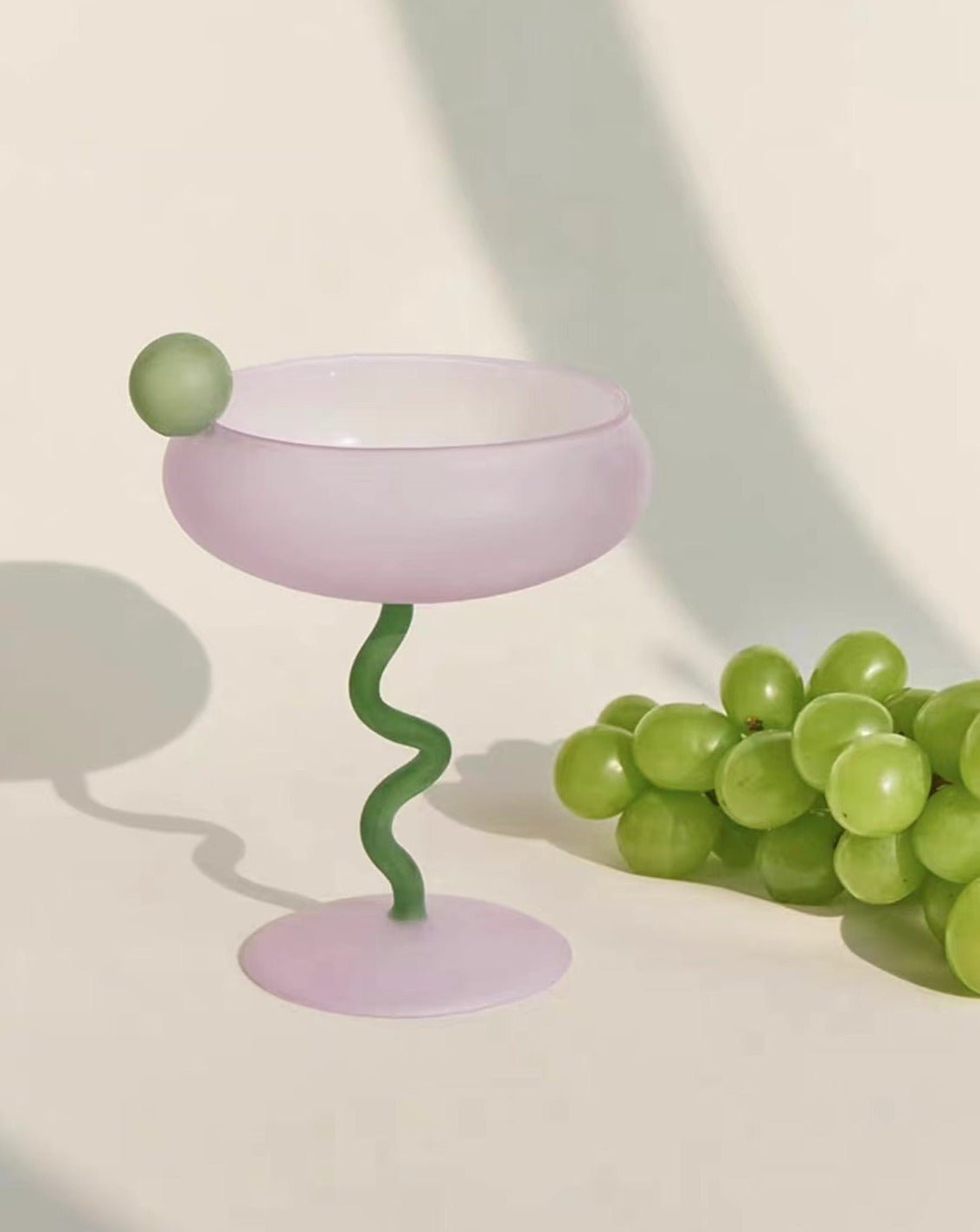 A colorful Jelly Bean Wine Glass with a whimsical design, perfect for cocktails and celebrations, showcasing artisan craftsmanship.