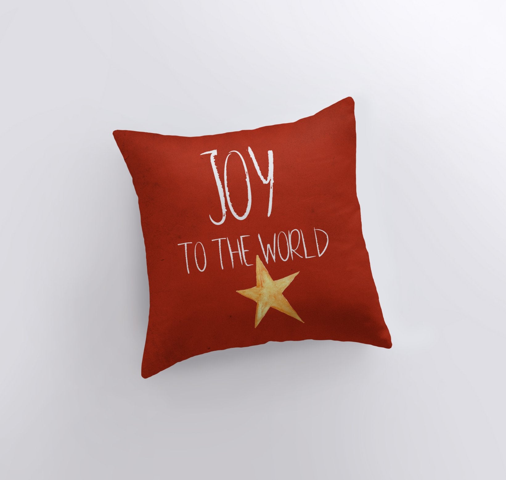 Handmade red throw pillow with 'Joy to the World' text and gold star, perfect for Christmas home decor.