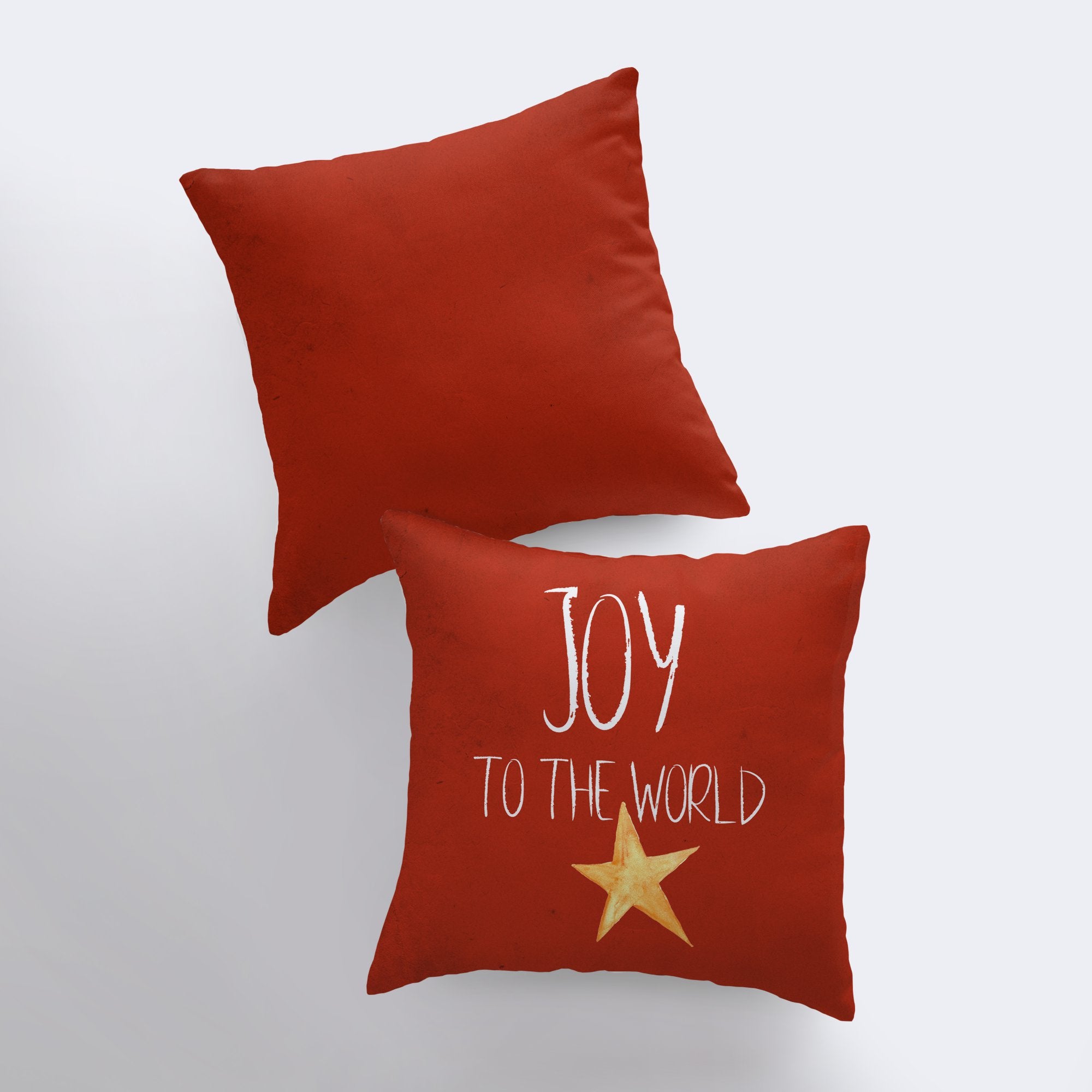 Handmade red throw pillow with 'Joy to the World' text and gold star, perfect for Christmas home decor.
