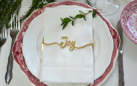 Set of 4 Joy Wrap Matte Gold Napkin Wraps elegantly displayed in a stylish box.