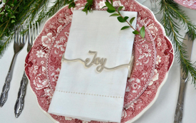 Set of 4 Joy Wrap Silver Napkin Wraps elegantly displayed in a stylish box.