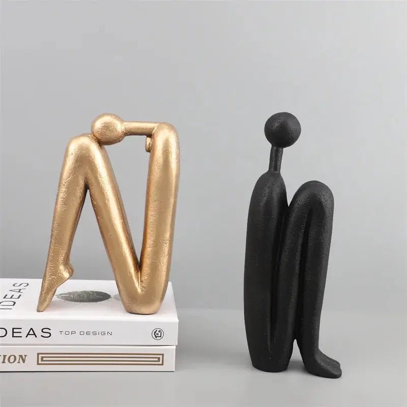 Kawaii Bookend in gold and black, featuring a modern human figure design, perfect for decor and book organization.