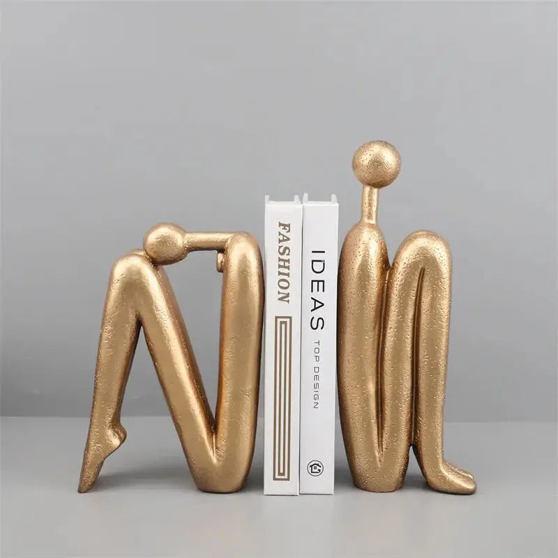 Kawaii Bookend in gold and black, featuring a modern human figure design, perfect for decor and book organization.