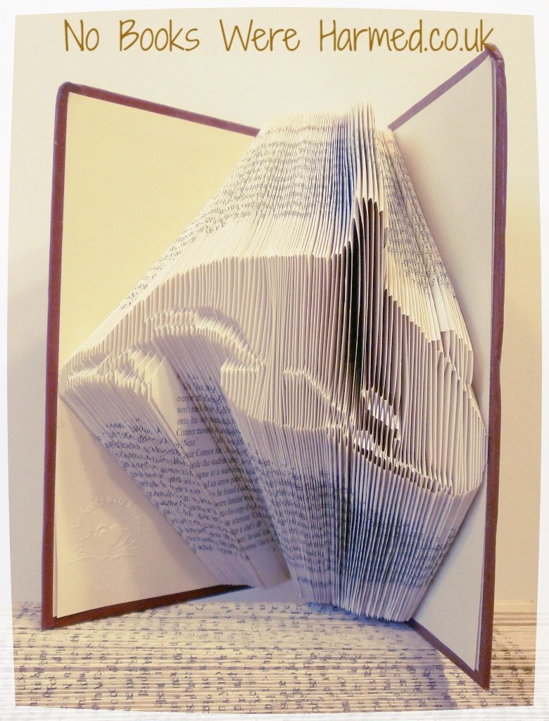 Handcrafted Killer Whale art piece made from vintage book pages, showcasing intricate folds and unique design.