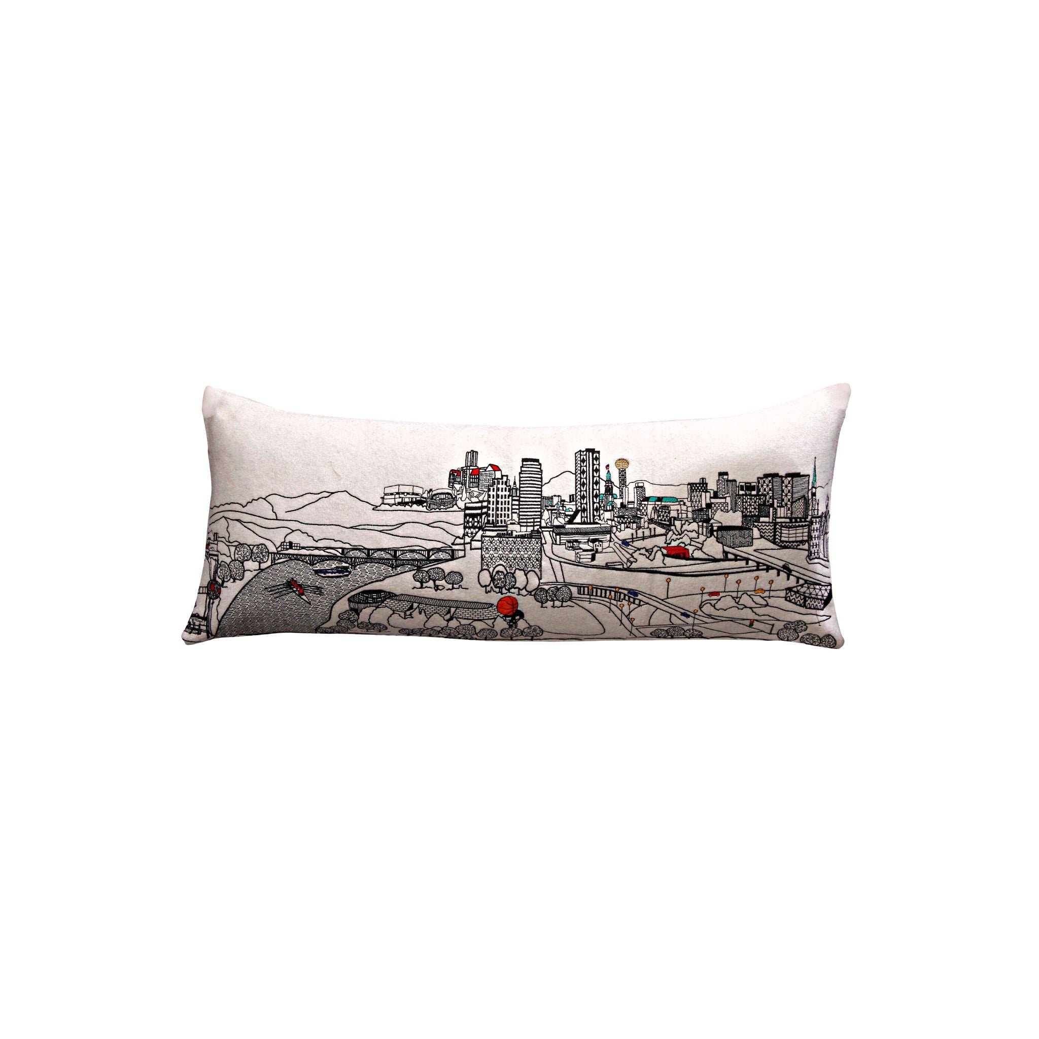 Knoxville Pillow featuring a vibrant design inspired by Knoxville, Tennessee, with a red zipper at the bottom.