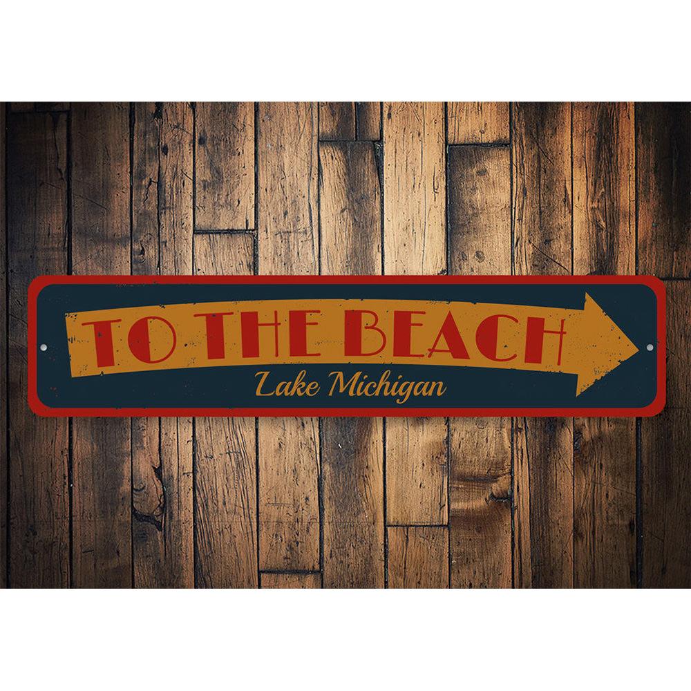 Lake Beach Arrow Sign made of high-quality aluminum, featuring customizable text and a coastal design, perfect for beach houses and decor.