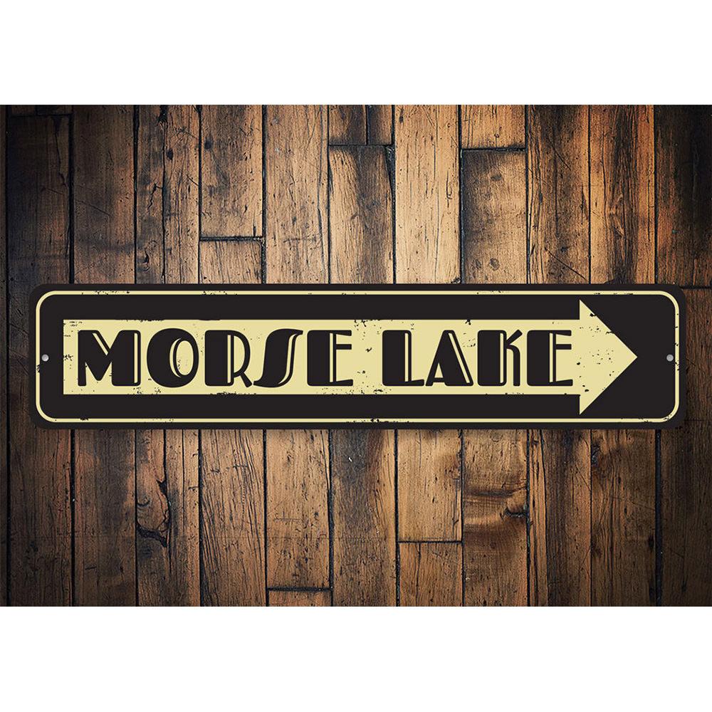 A personalized Lake Name Arrow Sign made of high-quality aluminum, featuring customizable text and a rustic design, perfect for lakehouse decor.