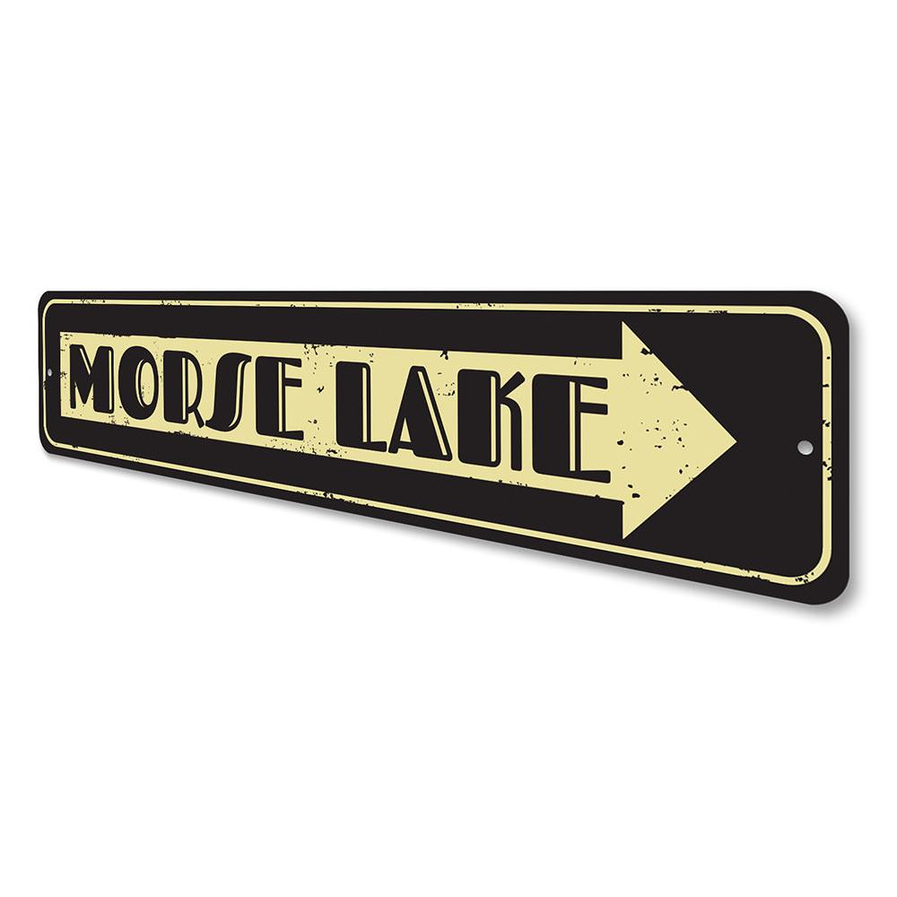 A personalized Lake Name Arrow Sign made of high-quality aluminum, featuring customizable text and a rustic design, perfect for lakehouse decor.