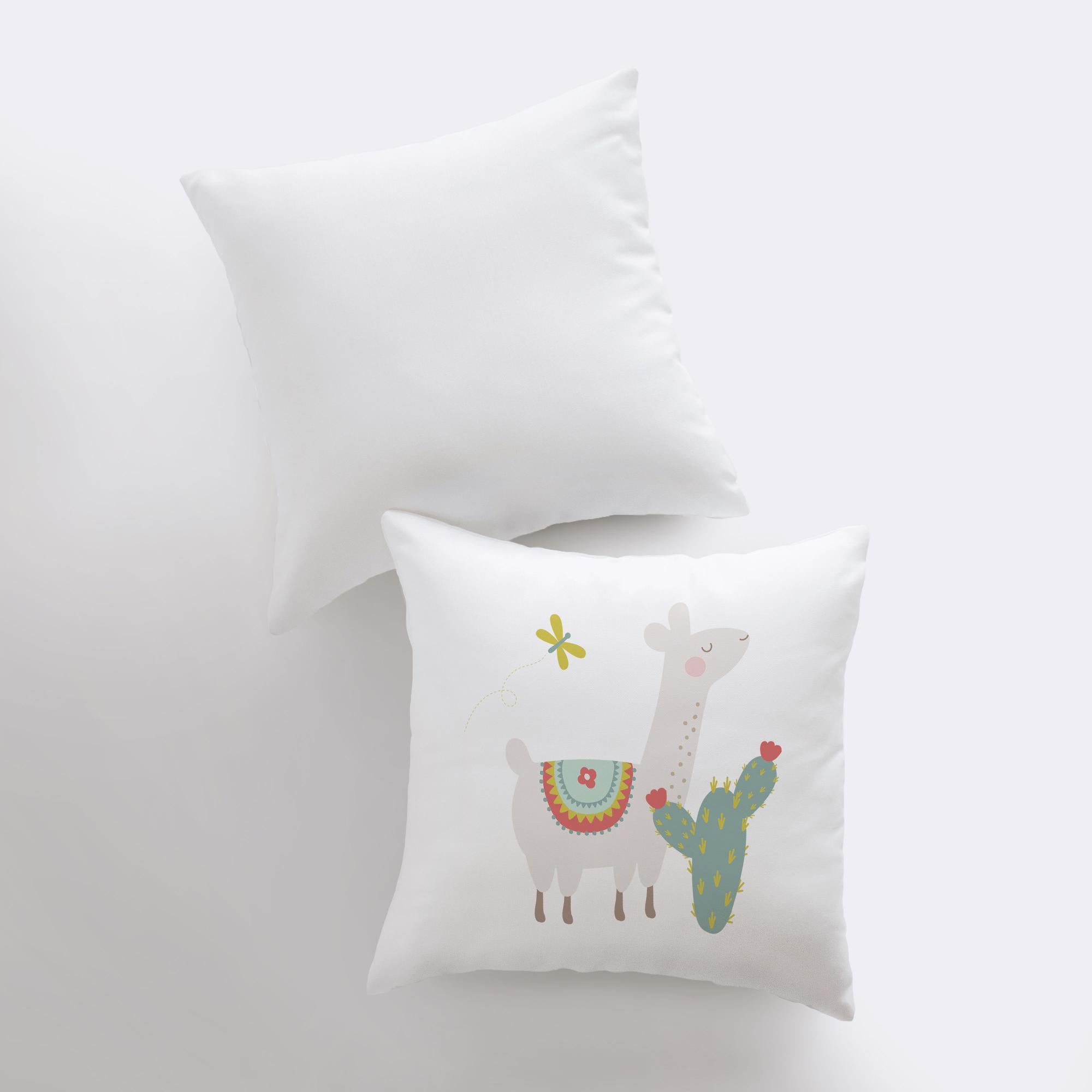 A charming Llama pillow featuring a green cactus design, handcrafted in America, showcasing a cute llama on the front and a white back.