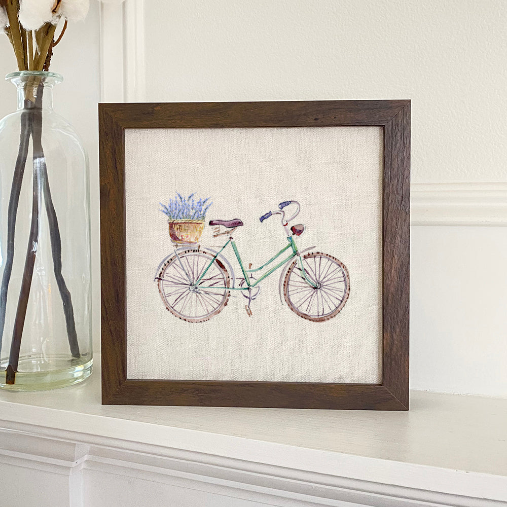 Lavender Bike Framed Sign with a stylized wood frame, eco-friendly printing on a linen-look background.