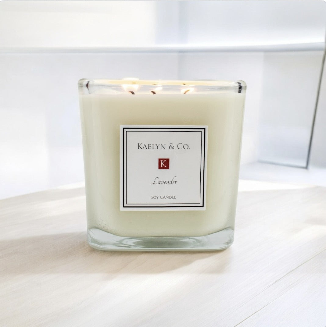 Lavender Large Cube Candle in a stylish cube shape, showcasing its rich lavender color and triple wicks, perfect for creating a calming ambiance.