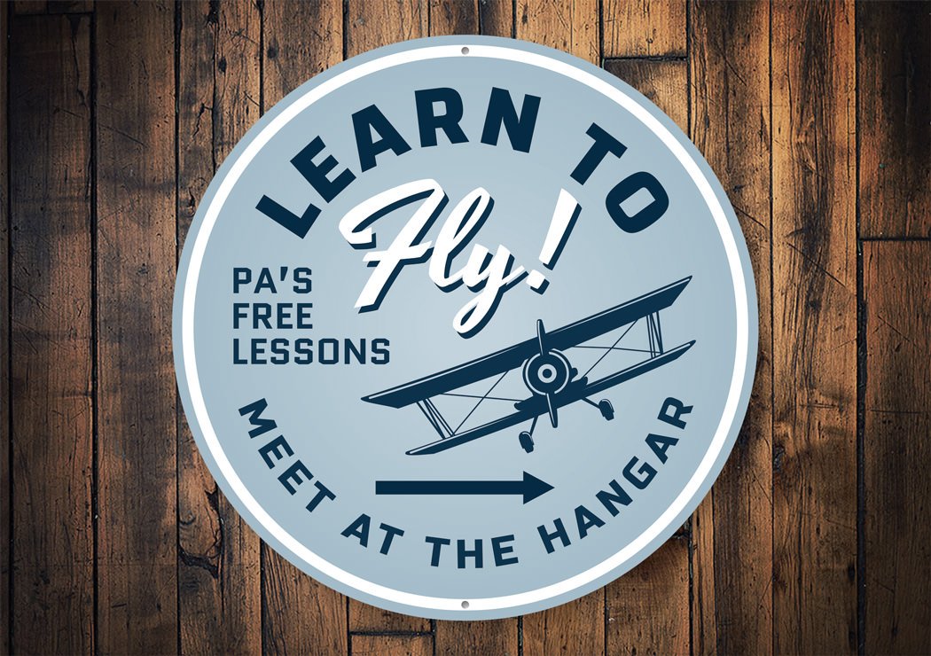 Customizable Learn to Fly Hangar Sign made from high-quality aluminum, featuring aviation-themed design, perfect for home decor.