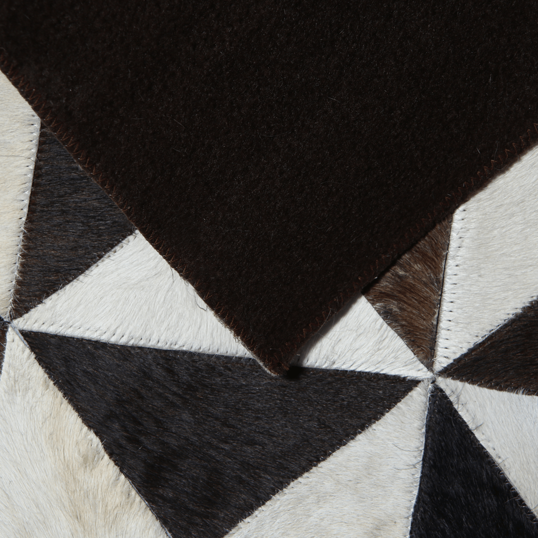 Handmade leather rug made from genuine cowhide, featuring a small pattern patchwork design, ideal for home decor.