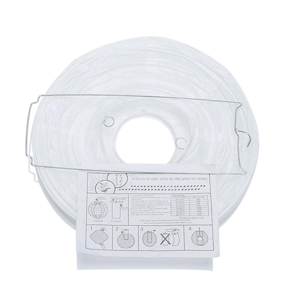 A set of colorful LED paper lantern lights hanging outdoors, illuminating a wedding venue with a warm glow.